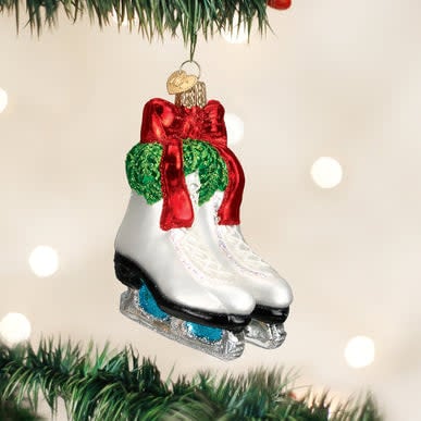 Holiday Skates Ornament featuring a glossy red ice skate with silver laces against a white background.