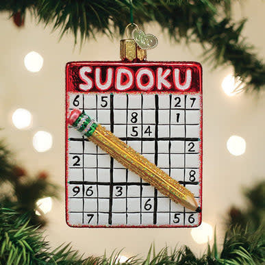 Sudoku Ornament featuring a white ceramic sphere with black printed number grids.