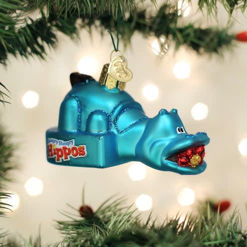 Hungry Hungry Hippos game ornament featuring four green hippo figures in a festive holiday design.