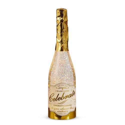 Gold plastic champagne bottle with swirling glitter inside a clear glass cylinder