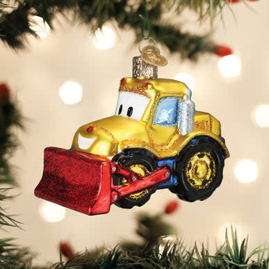 Bright-eyed plastic bulldozer toy ornament with friendly face.