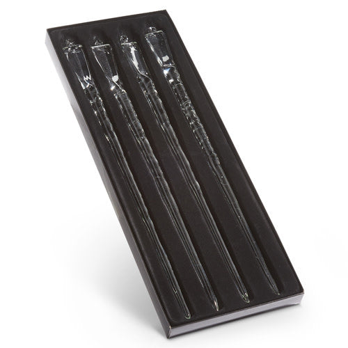 Box of fifteen clear glass icicle ornaments with shimmering finish hanging vertically.