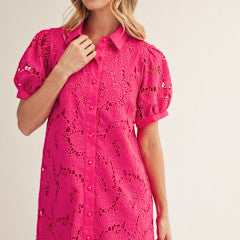 Short-sleeve button-down eyelet shirt dress with scallop hem and wide pockets in light color.