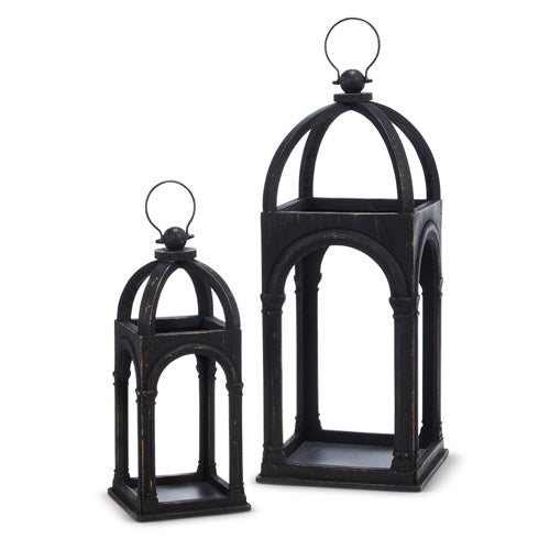Black arch-shaped lantern with wood frame and iron accents.