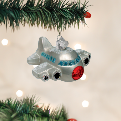 Mouth-blown glass airplane ornament with silver interior and colorful lacquer paint.