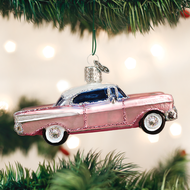 Classic car ornament shaped like a vintage automobile with rear fins in metallic finish.