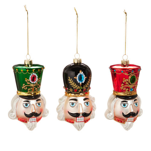 Glass nutcracker head ornament with a classic soldier silhouette in red and black.