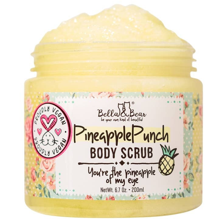 Pineapple Punch body scrub in a clear jar with pink paste visible inside