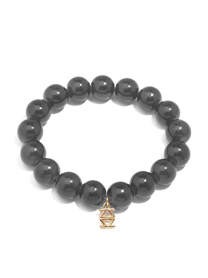 Stretch bracelet with glossy lucite glass beads in a solid color.