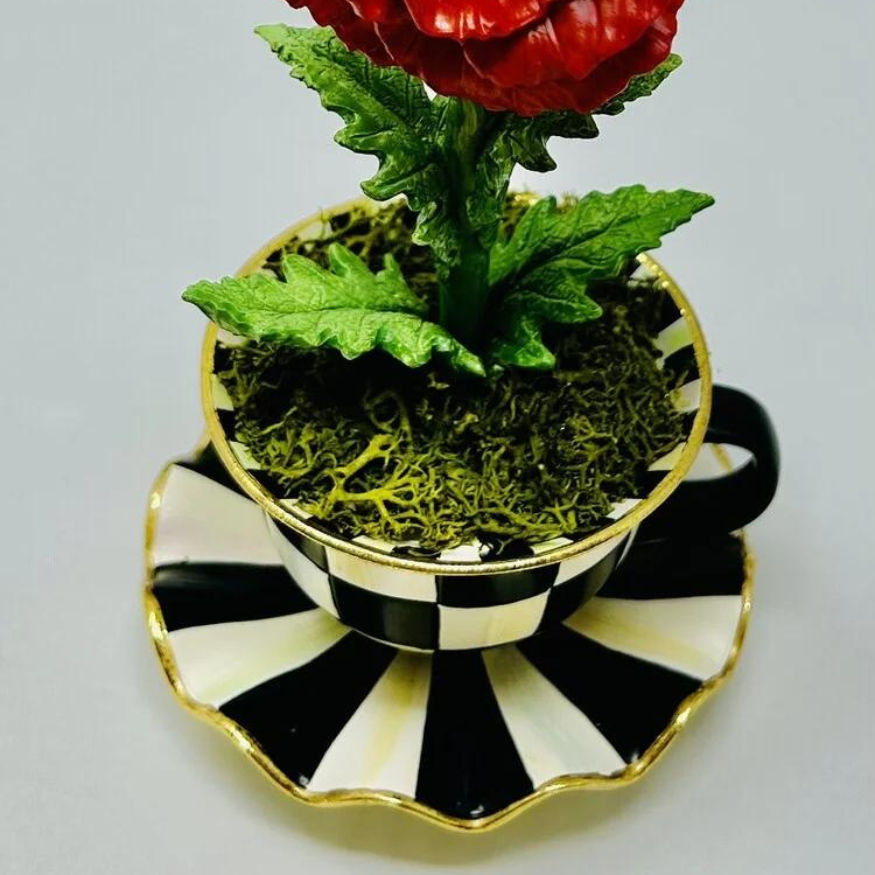 Teacup Poppy: a white ceramic teapot with pink poppy floral pattern and curved handle.