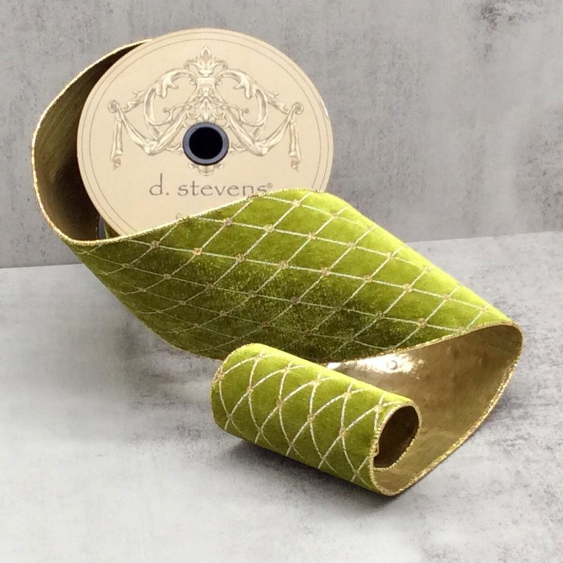 4 inch chartreuse velvet ribbon with gold diamond embroidery pattern on a spool.