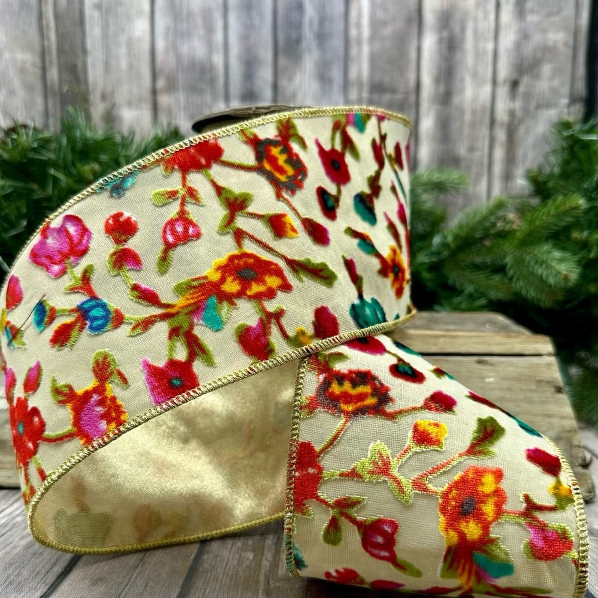 4-inch wide cream ribbon with a burnout velvet floral pattern in hot pink, yellow, and teal.