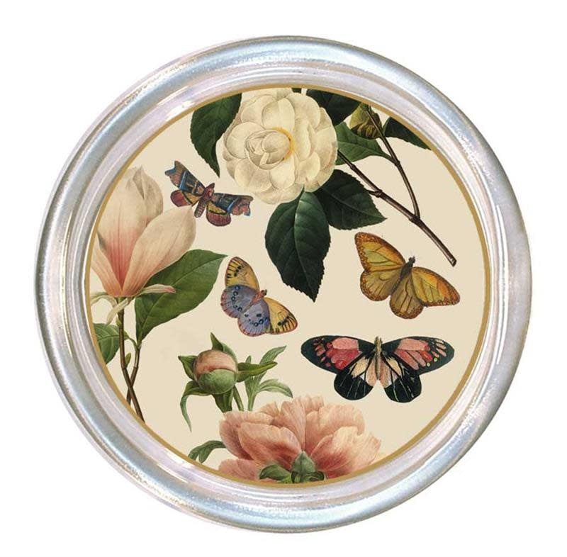 Five-inch glass coaster with high rim on ivory background featuring floral pattern.