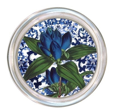 Glass coaster with blue floral pattern on a black velvet base