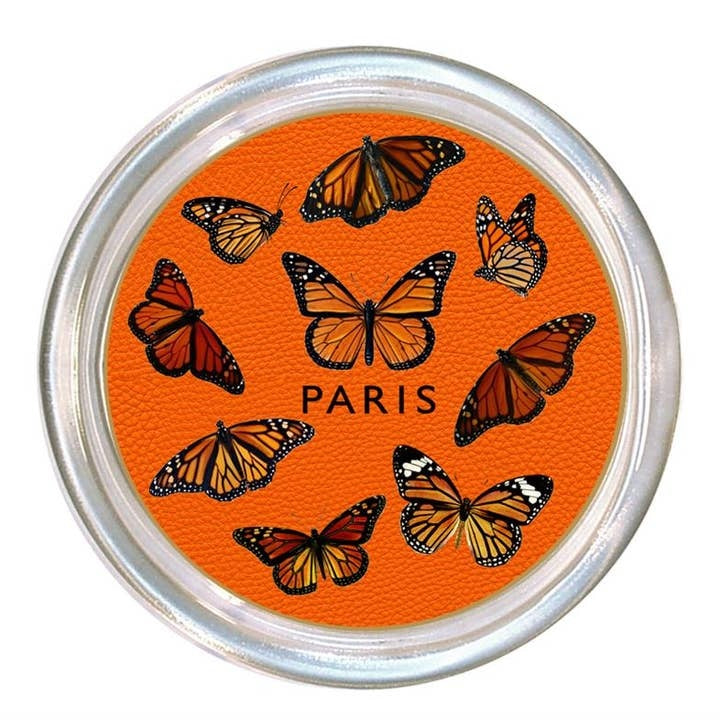 Glass coaster with a high rim and black velvet back.