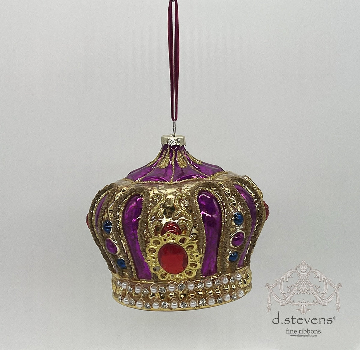 5.125-inch magenta and gold glass crown ornament with red, blue, and pearl jewel accents.