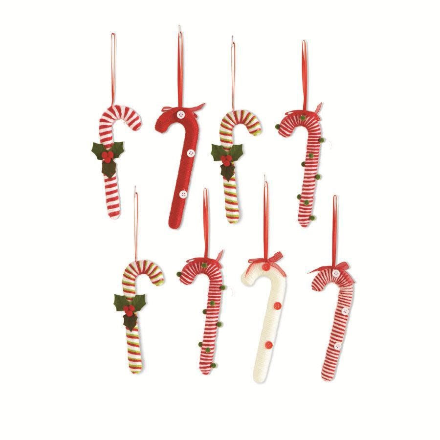 Fabric candy cane ornament with red and white stripes.