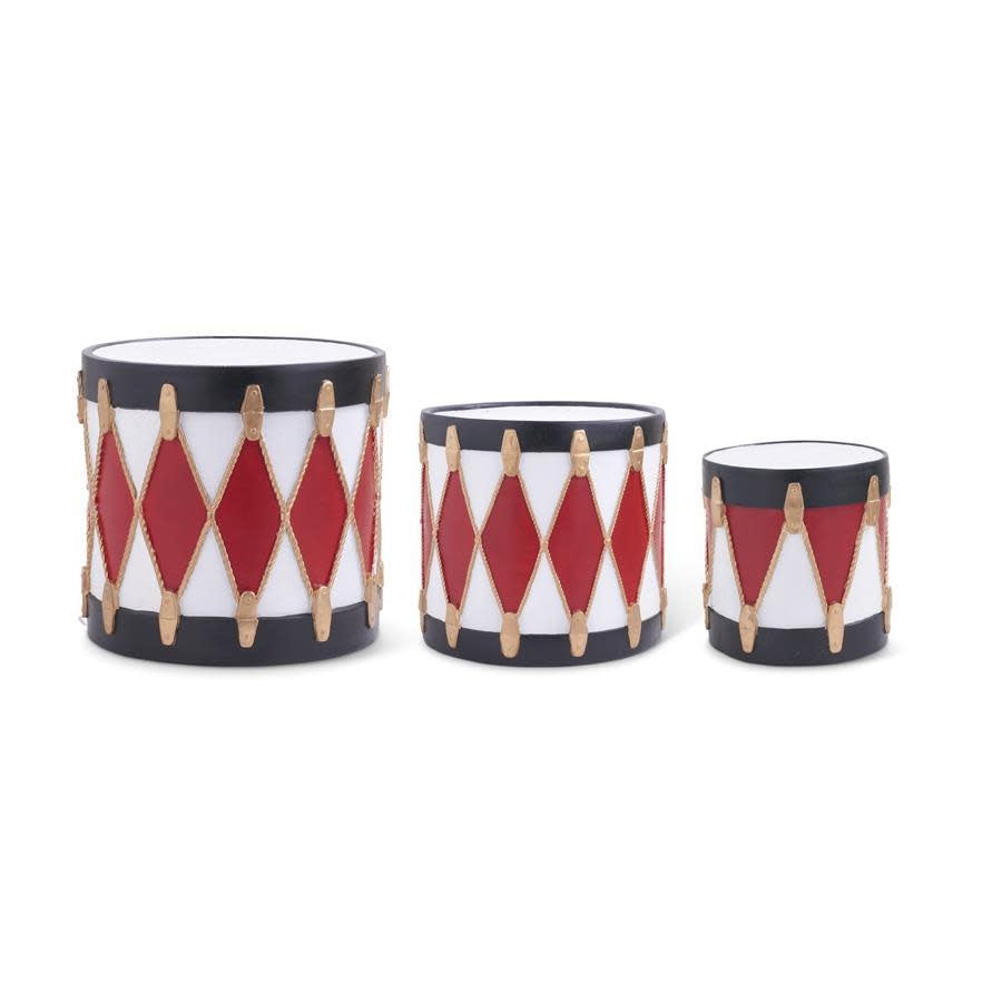 Polyresin decorative drum in red with black and white geometric patterns.