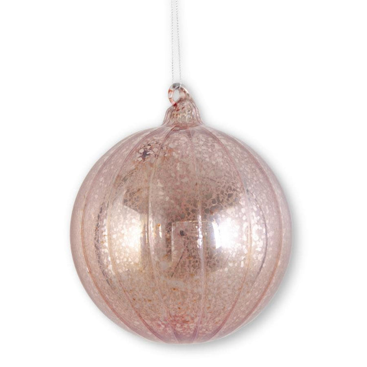 Round light pink ribbed mercury glass Christmas ornament with a reflective finish