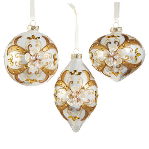 Glass Christmas ornament with floral embellishments in red and green tones