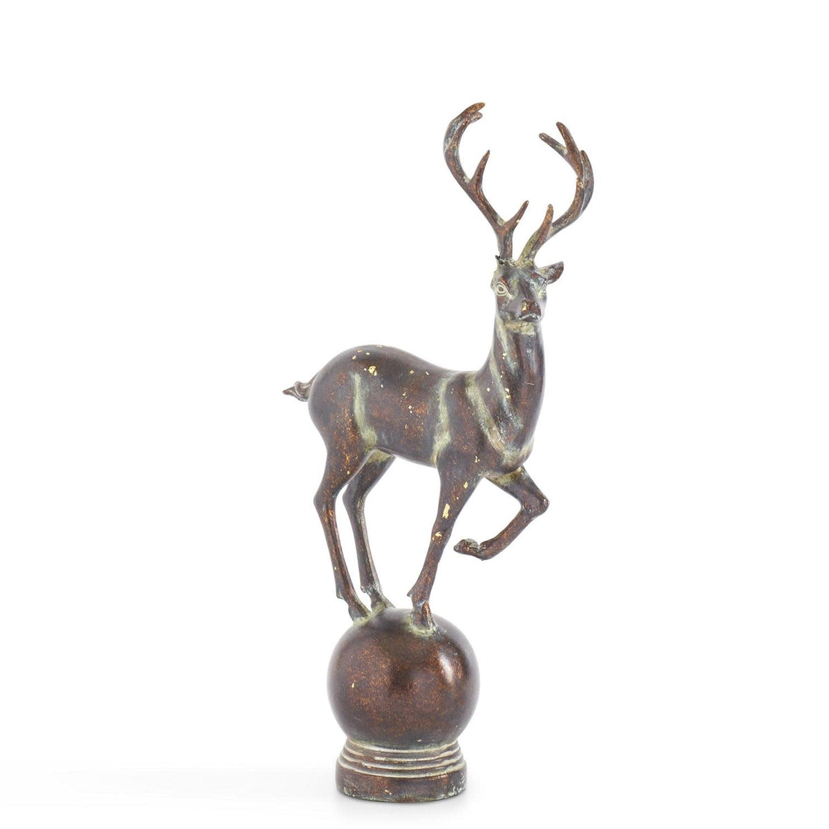 Whitewashed brown resin deer figurine standing on a spherical base.