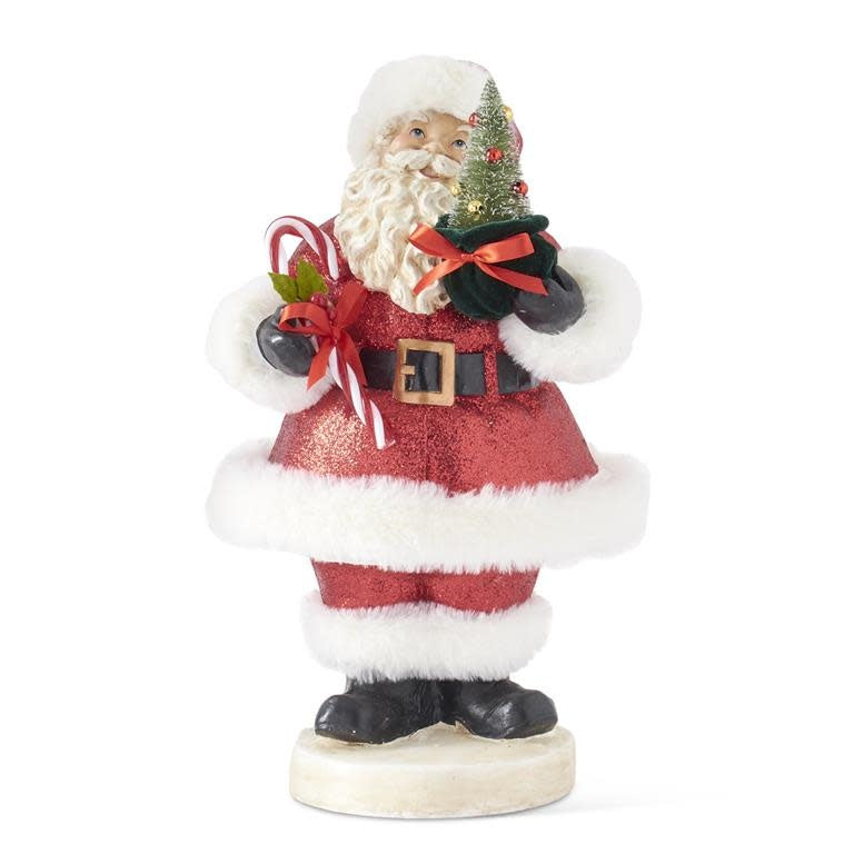 Vintage Santa figurine with red glittered coat holding a candy cane