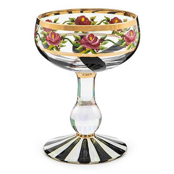 Hand-painted Maypole Coupe glass with green ribbon swirls, pink roses on a pearlescent stem and gold lustre trim.