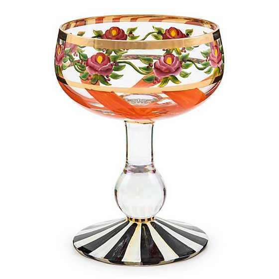 Hand-painted Maypole Coupe glass with green ribbon swirls, pink roses on a pearlescent stem, and gold lustre trim.