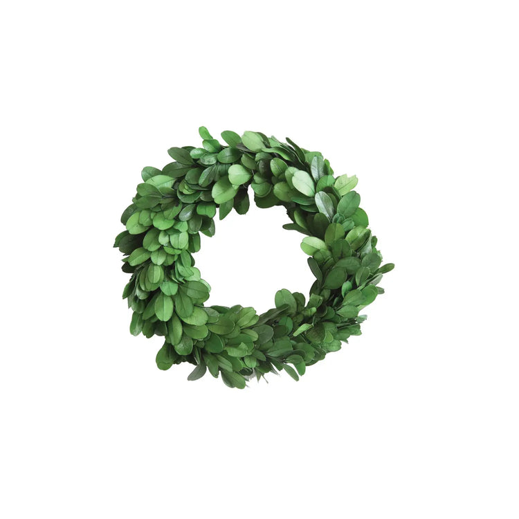 6-inch round preserved boxwood wreath in deep green with a flat silhouette.