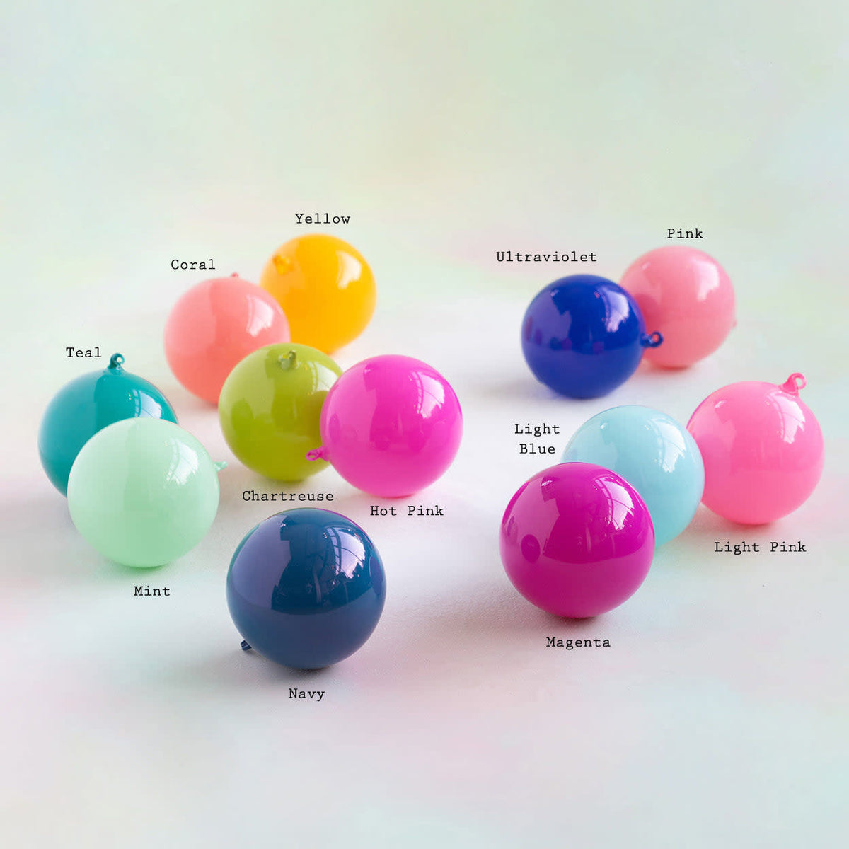 Six-inch hand-blown glass sugar plum ball ornament with vibrant lacquer coating.