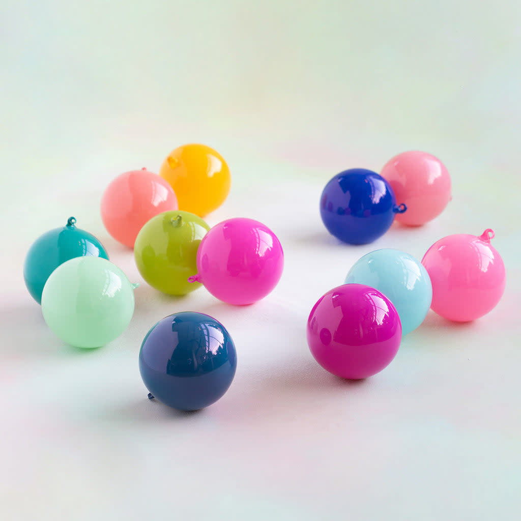 Six-inch hand-blown glass sugar plum ball ornament with vibrant lacquer coating.