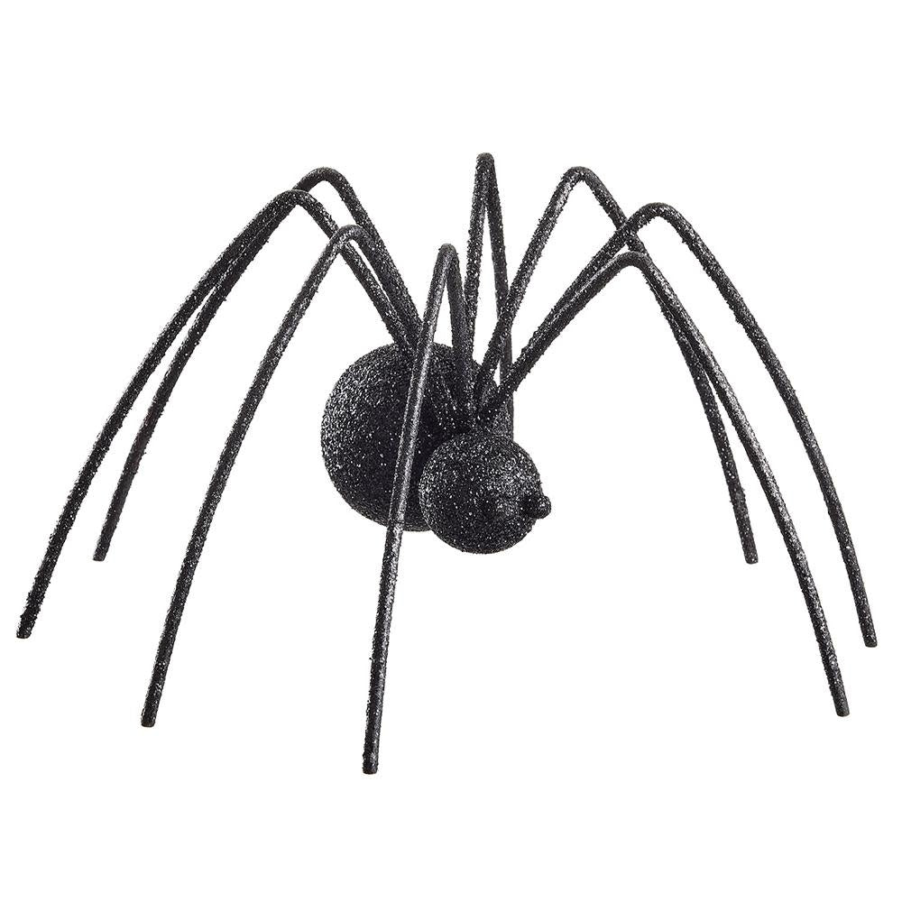 Black glittered fur spider with plastic legs on a white background