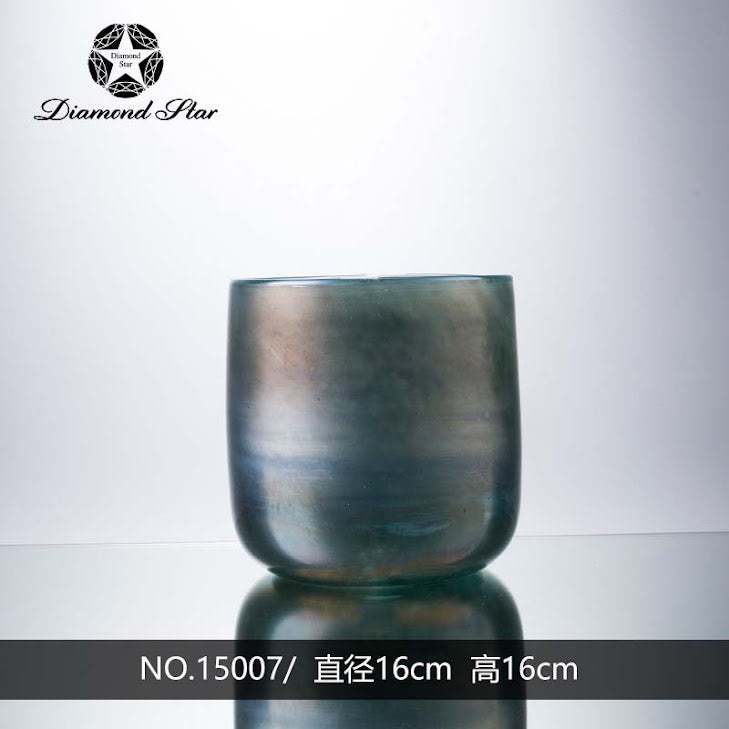 Clear glass vase with a sleek cylindrical shape designed to hold floral arrangements.