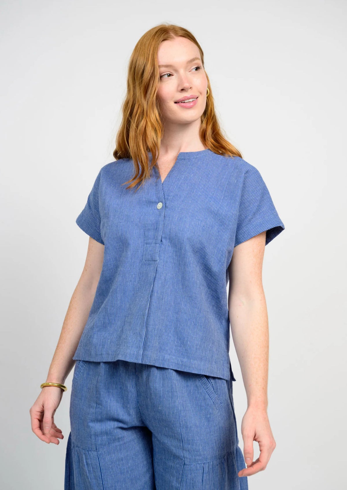 Women's popover stripe top with cap sleeves in a wide fit.