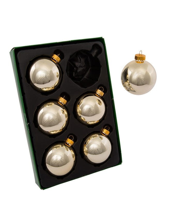 Set of six shiny gold glass ball ornaments with a reflective finish.