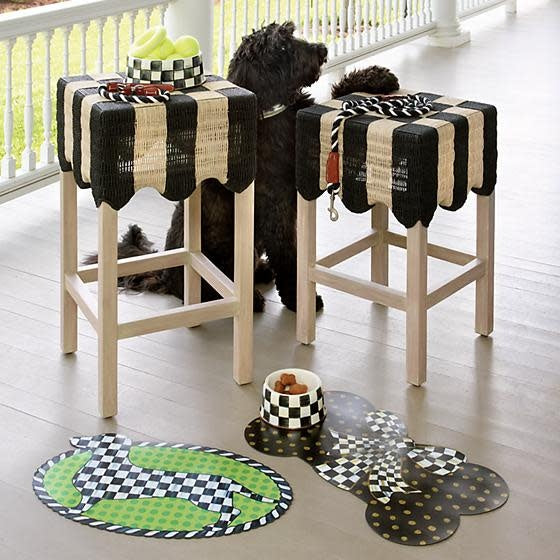 Bone-shaped black polypropylene placemat with gold dots and a Courtly Check ribbon bow.