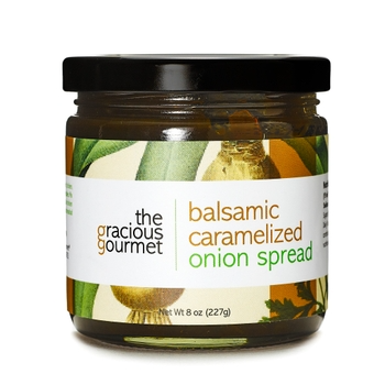 Jar of Balsamic Caramelized Onion Spread with visible caramelized onions in a clear container
