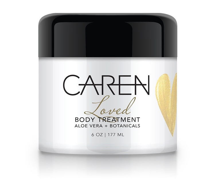 Glass jar containing Loved Body Treatment with a woody amber floral scent.