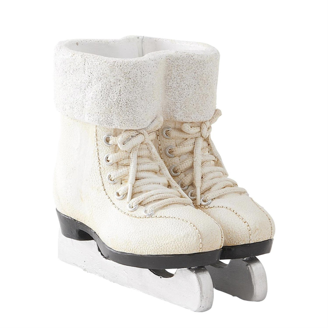 White resin ice skate figurine pair with glittered lining and detailed laces.