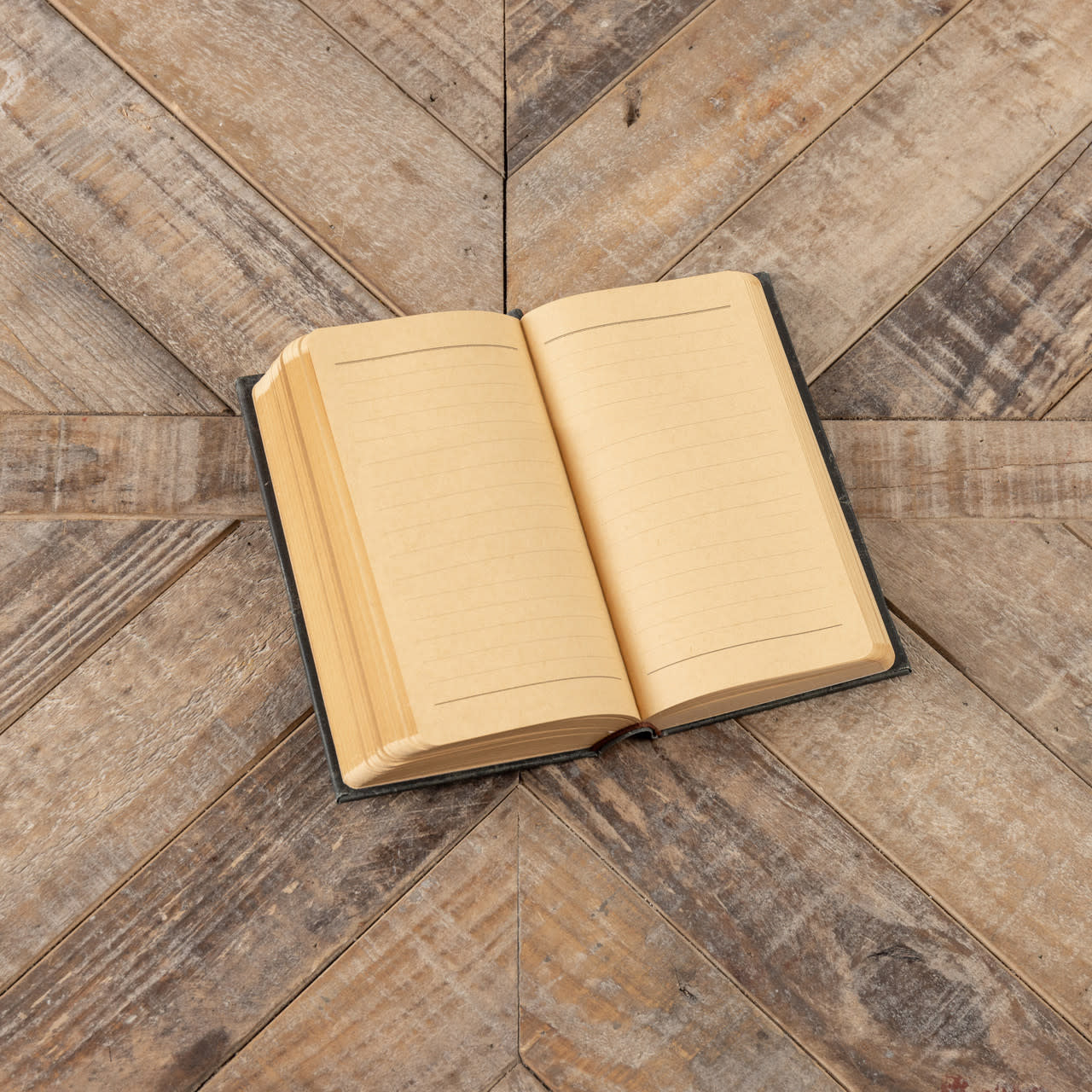 7-inch Revolt of a Daughter journal with classic wood cover and paper pages.