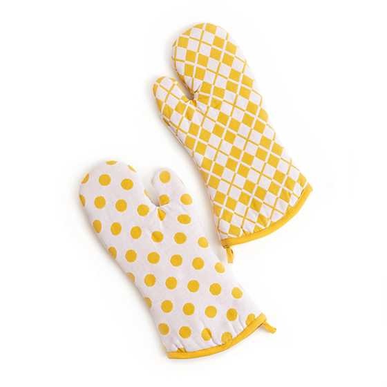 Yellow cotton oven mitts with white argyle patterns