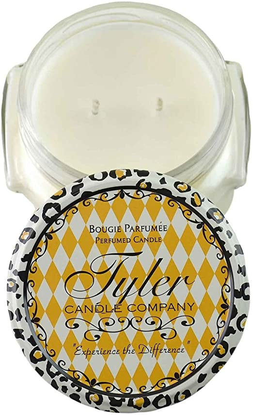 A white ceramic jar containing a Tyler Candle with visible wax surface.