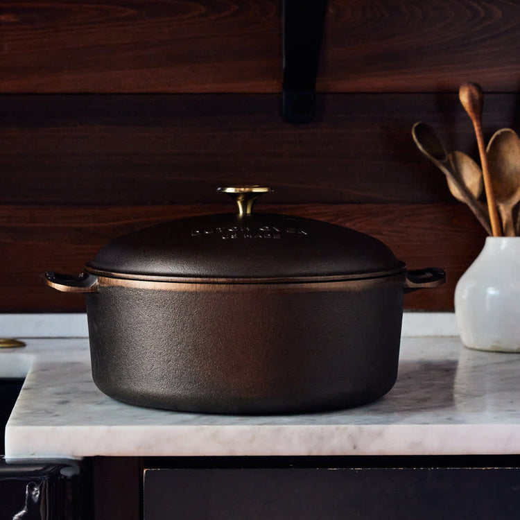 Polished stainless steel Dutch oven with domed lid