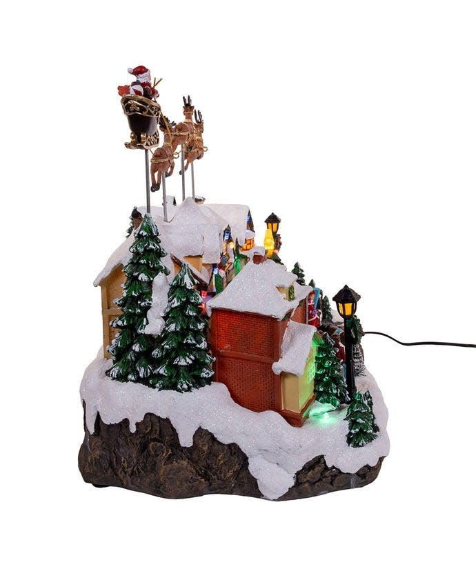 Resin Santa figure in sleigh with multicolor LED lights playing Christmas music.