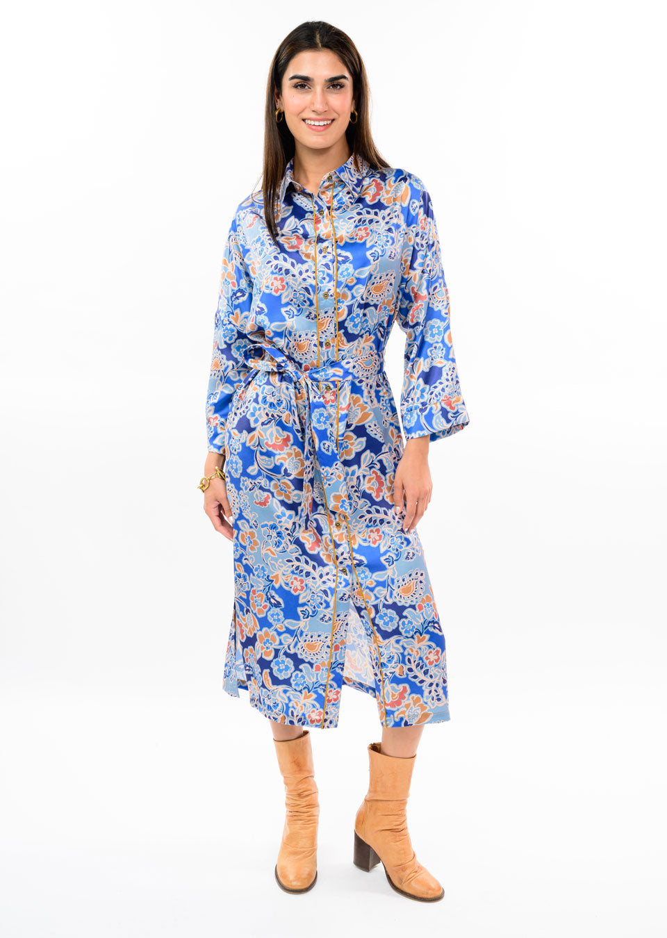 Woman wearing the Aubrey Satin Floral Shirt Dress in blue with tan boots.
