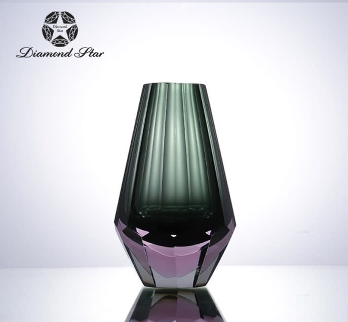 Clear glass vase with a square silhouette measuring approximately five inches wide by eight inches tall.