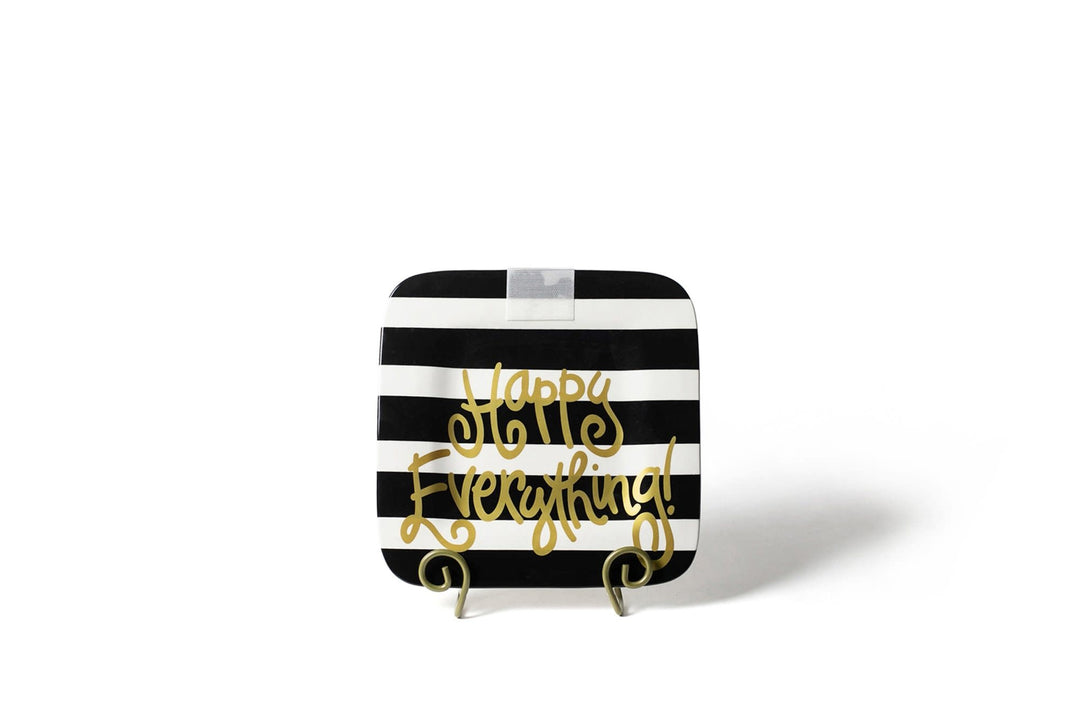 Ceramic mini platter with black stripe pattern featuring a happy face silhouette.