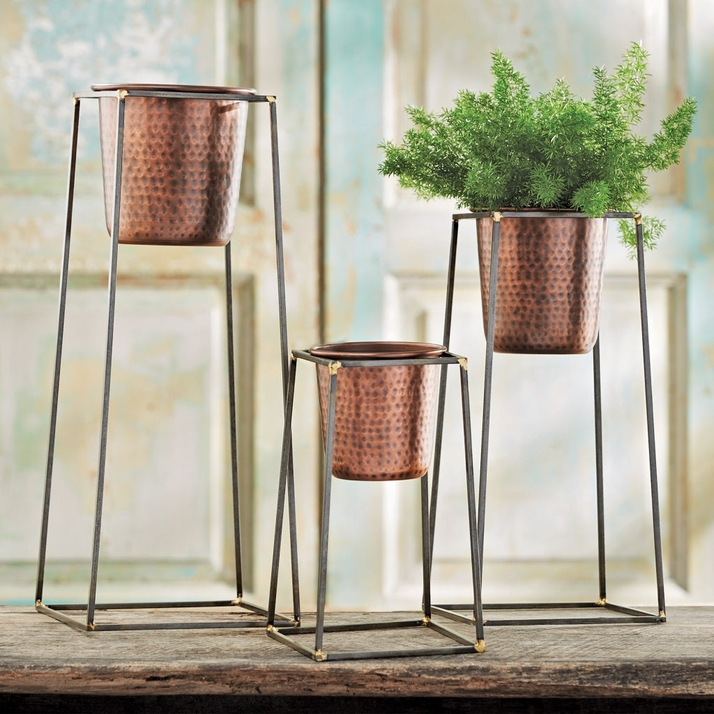 Small cast iron plant stand with removable hammered copper pot