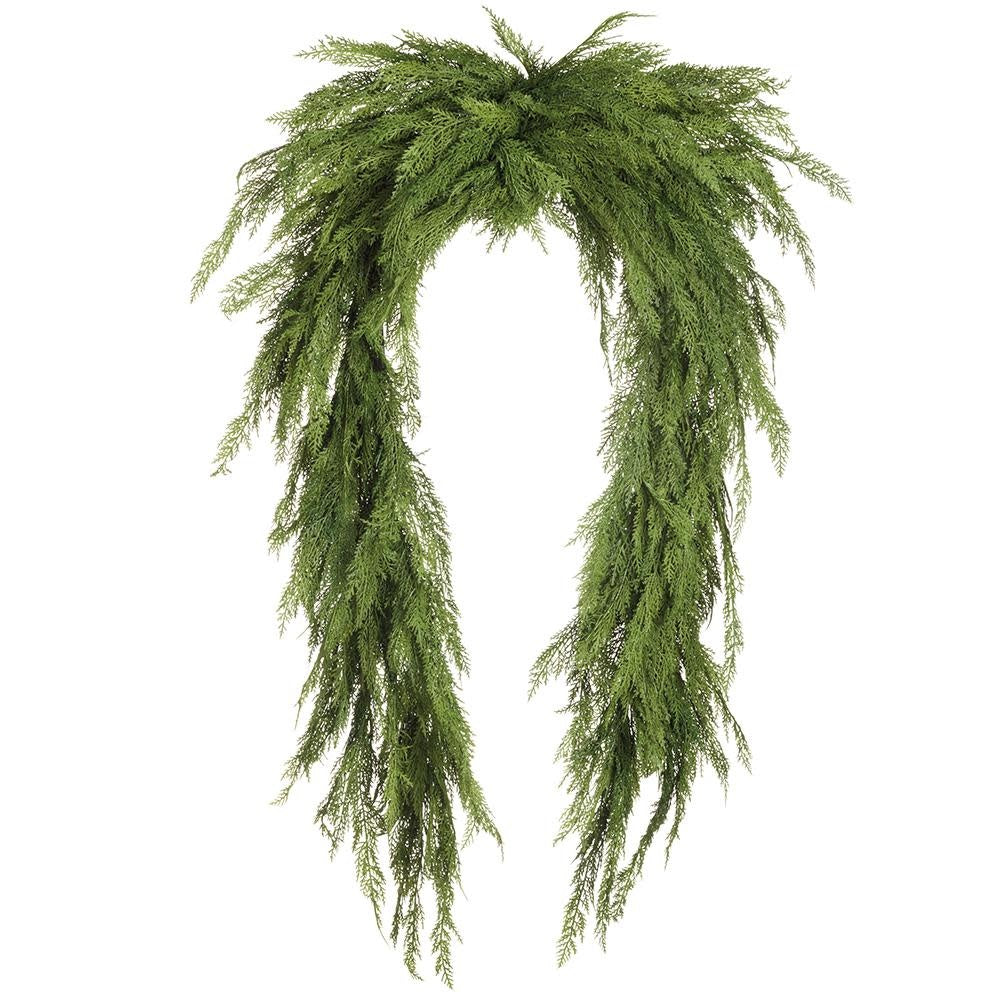 Eight-foot green cedar swag garland with artificial leaves hanging in a curved silhouette.