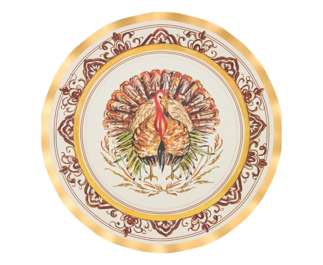 Wavy-edge disposable dinner plate with gold foil rim and central turkey illustration on paper.